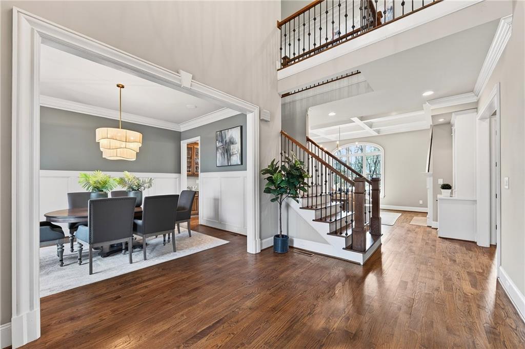16750 Quayside Drive Milton, GA 30004 - Photo 4 of 53 a view of a dining room with furniture and wooden floor