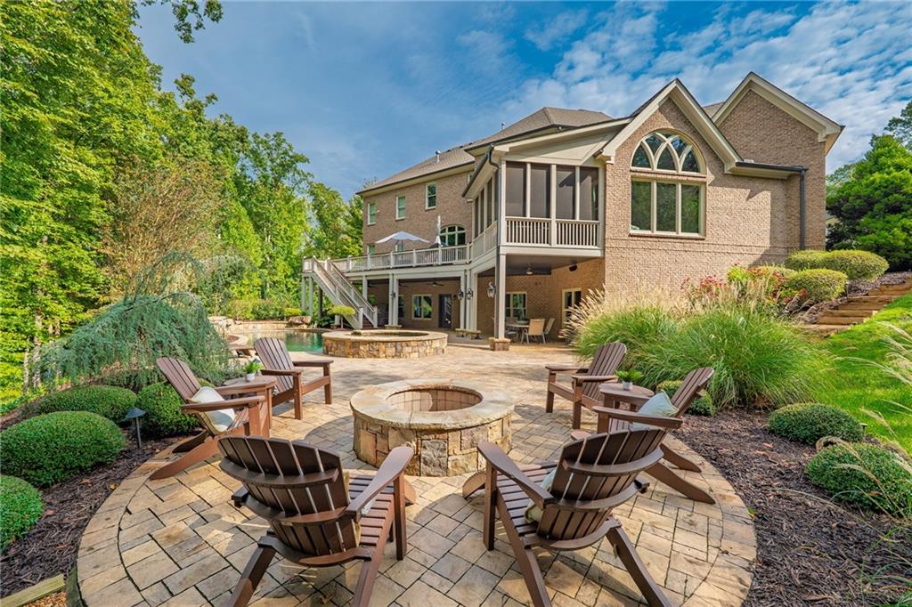 16750 Quayside Drive Milton, GA 30004 - Photo 41 of 53 a view of a patio with table and chairs and potted plants