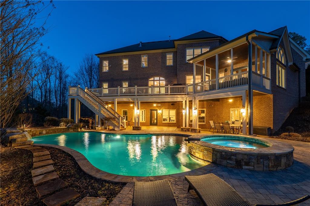 16750 Quayside Drive Milton, GA 30004 - Photo 43 of 53 a front view of a house with swimming pool