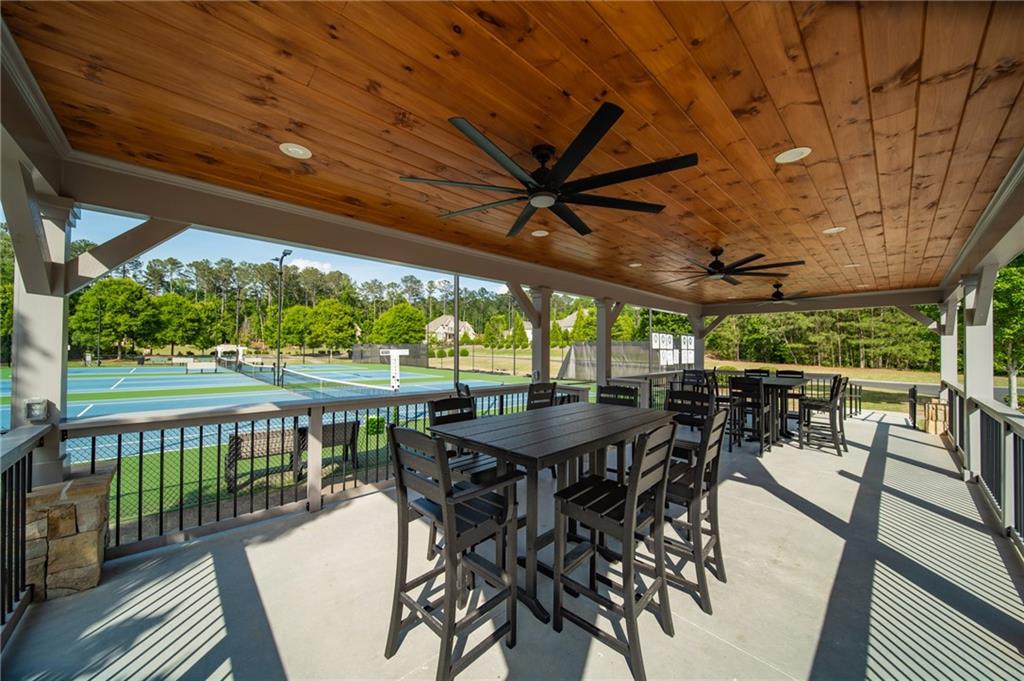 16750 Quayside Drive Milton, GA 30004 - Photo 47 of 53 a view of a patio with a table chairs and a backyard