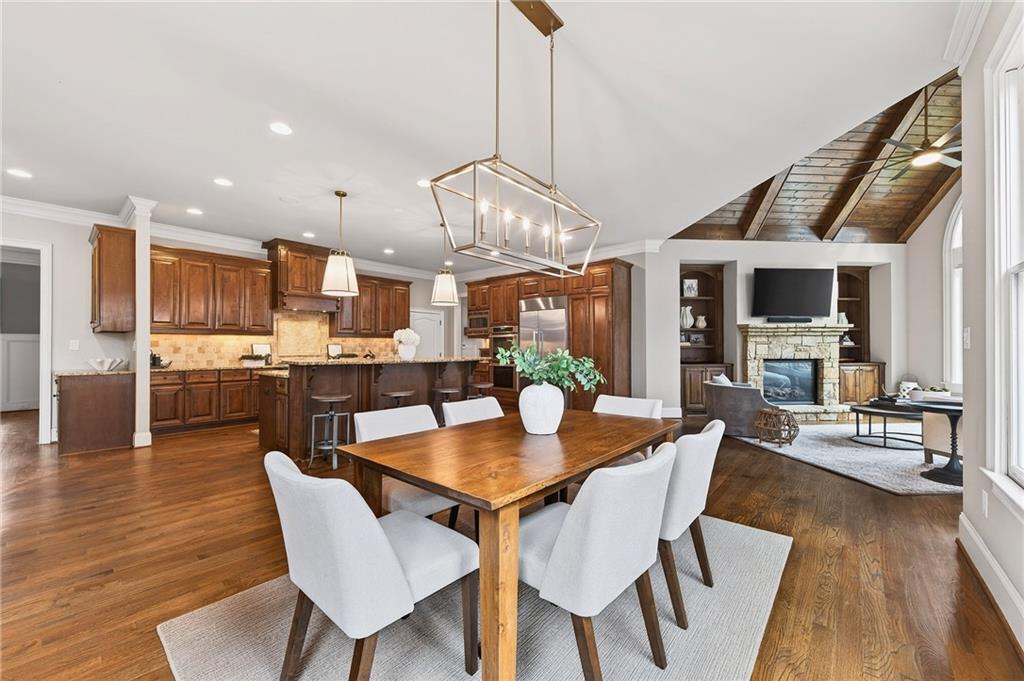 16750 Quayside Drive Milton, GA 30004 - Photo 9 of 53 a view of a dining room with furniture wooden floor and chandelier