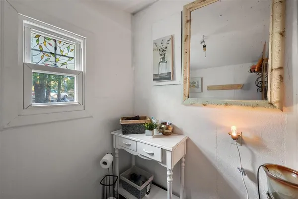 a bathroom with a sink and a window
