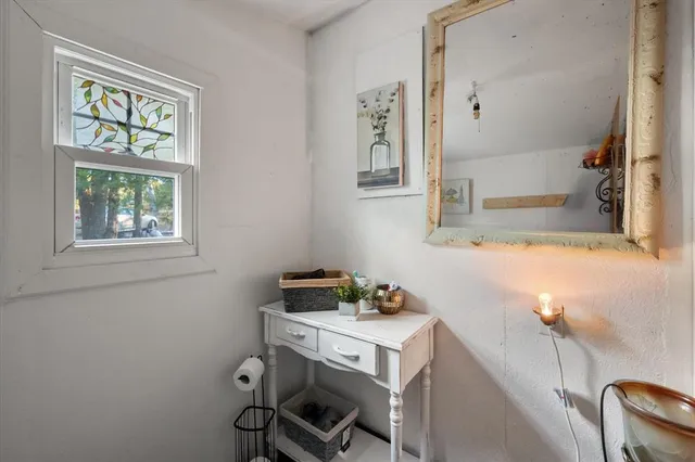 a bathroom with a sink and a window