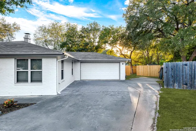 a house view with a backyard space