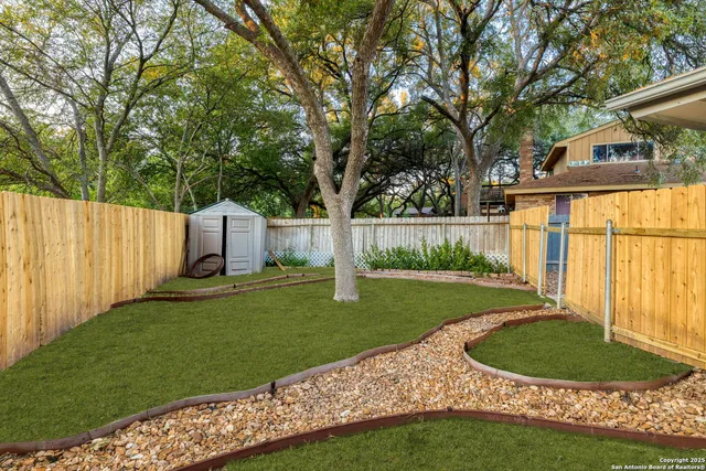 a view of backyard with green space