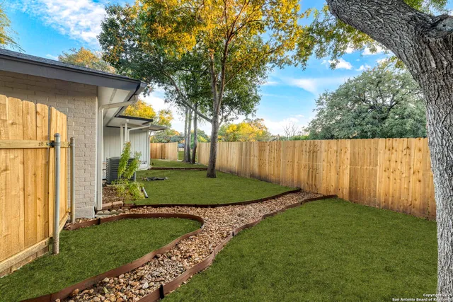 a view of a back yard of the house