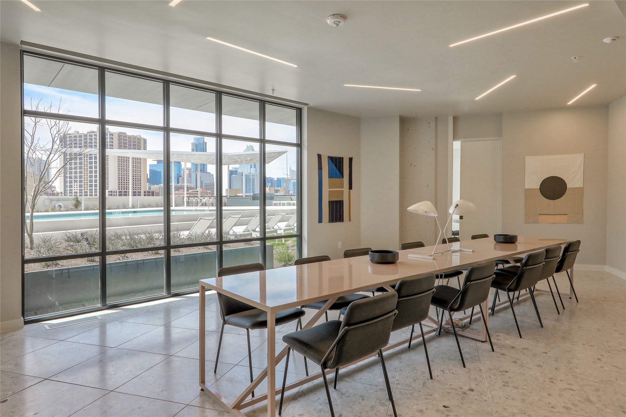 800 Embassy Drive, Unit 602 Austin, TX 78702 - Photo 28 of 37 Spacious communal area featuring floor-to-ceiling windows, linear ceiling lighting, and terrazzo-style flooring