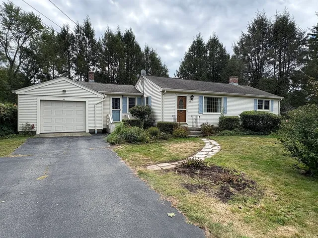 front view of a house with a yard