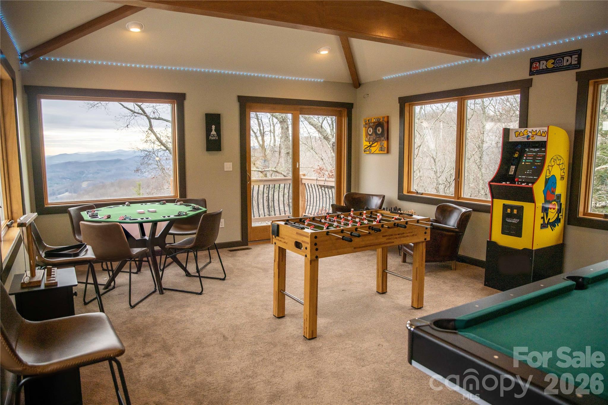 425 Flat Top Mountain Road Fairview, NC 28730 - Photo 11 of 48 a room with furniture pool table and a large window
