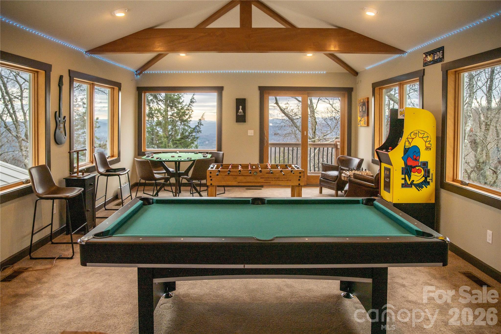 425 Flat Top Mountain Road Fairview, NC 28730 - Photo 12 of 48 a room with pool table two windows and outdoor view