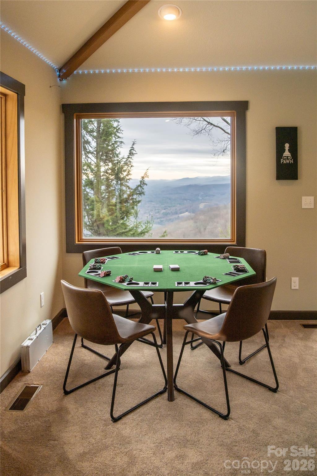 425 Flat Top Mountain Road Fairview, NC 28730 - Photo 13 of 48 a dining room with furniture and a window