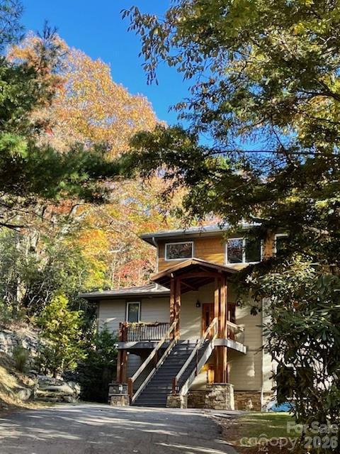 425 Flat Top Mountain Road Fairview, NC 28730 - Photo 2 of 48 a view of multiple houses with city street