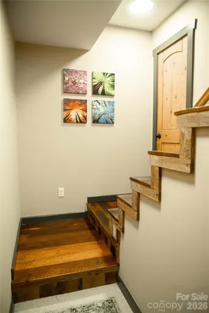 a view of a hallway with wooden shelves