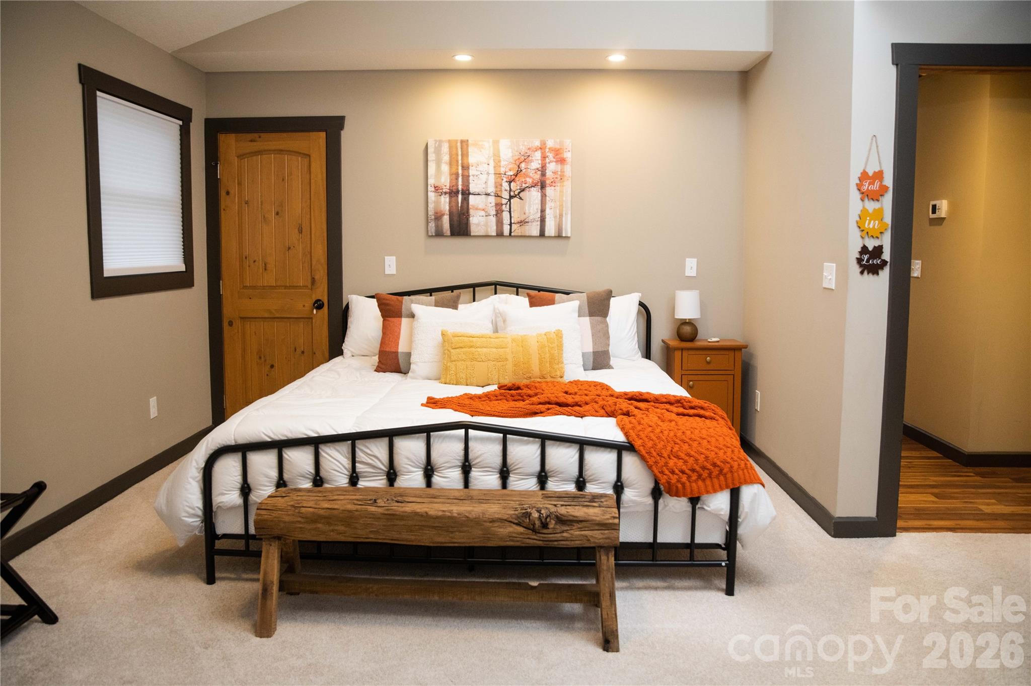 425 Flat Top Mountain Road Fairview, NC 28730 - Photo 25 of 48 a bed sitting in a bedroom next to a window