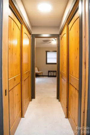 a spacious bathroom with a tub sink and mirror