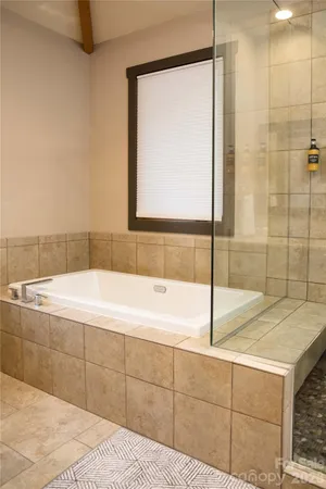 a bathroom with a sink vanity and mirror