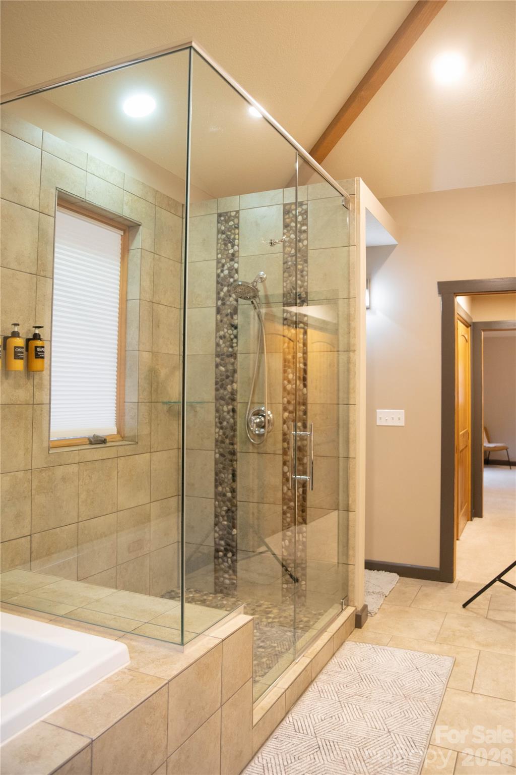 425 Flat Top Mountain Road Fairview, NC 28730 - Photo 31 of 48 a bathroom with a glass shower door