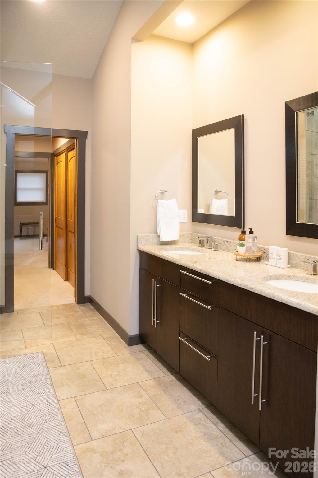 425 Flat Top Mountain Road Fairview, NC 28730 - Photo 32 of 48 a bathroom with a sink vanity and mirror