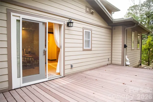 a bedroom with a bed and painting on the wall