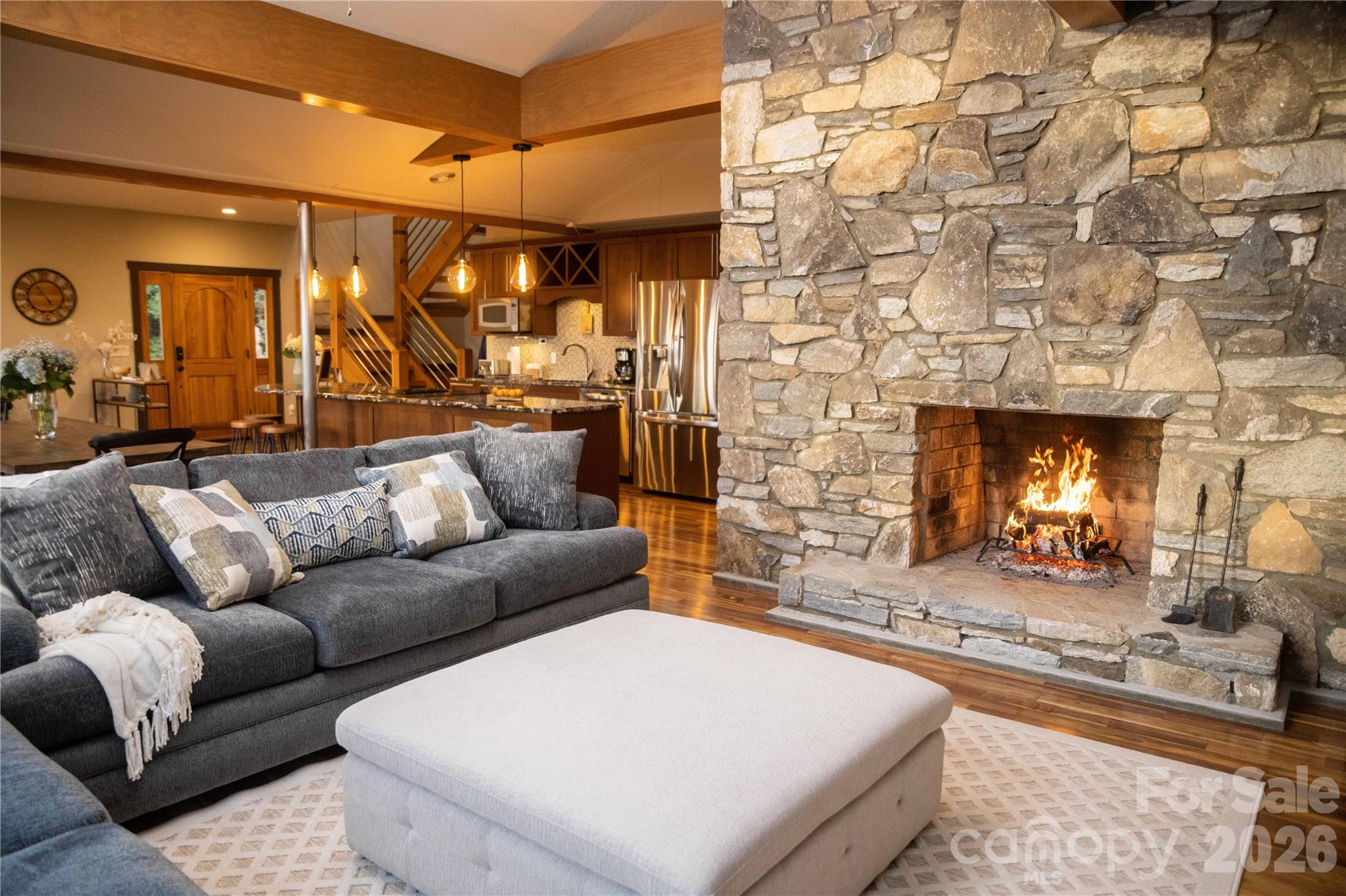 425 Flat Top Mountain Road Fairview, NC 28730 - Photo 4 of 48 a living room with furniture and a fireplace