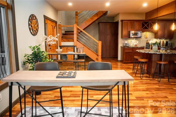 a view of a dining room with furniture and a table
