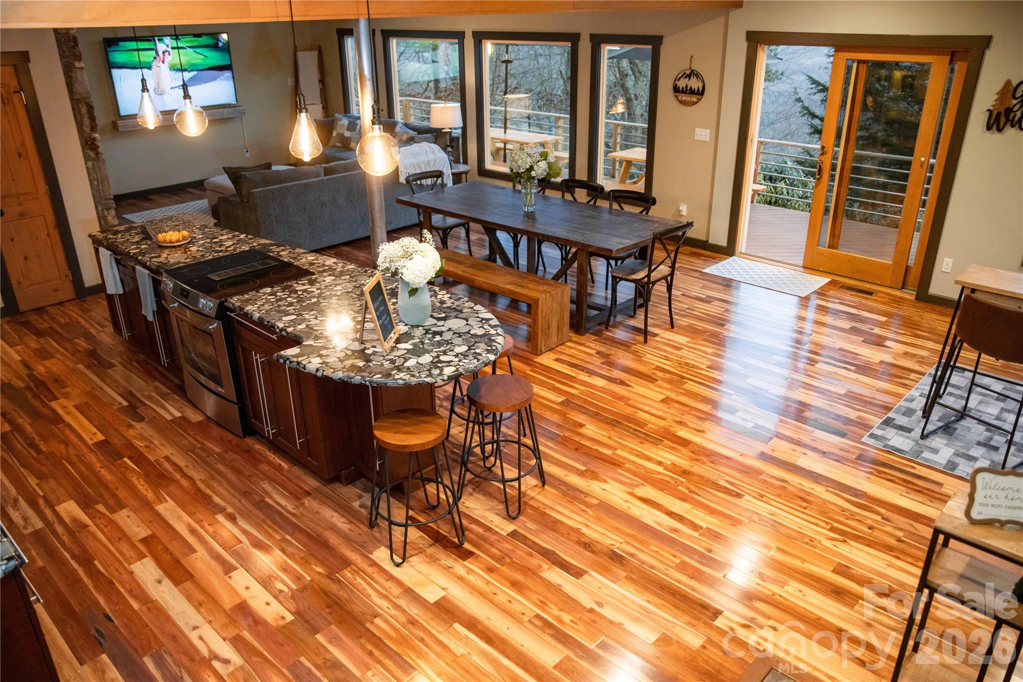 425 Flat Top Mountain Road Fairview, NC 28730 - Photo 9 of 48 a workspace with furniture window and wooden floor