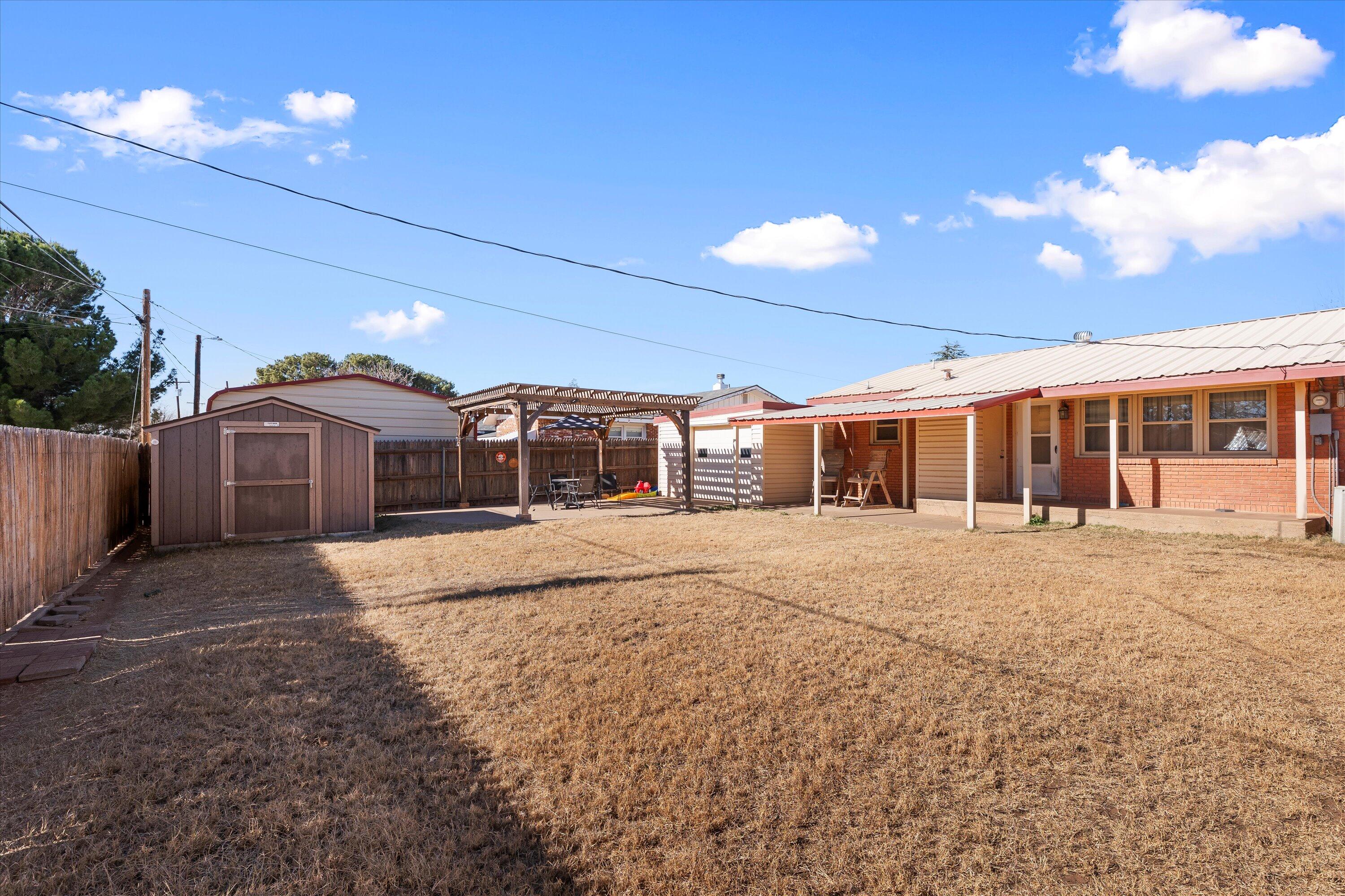804 2nd Street Plains, TX 79355 - Photo 18 of 18 a front view of a house with a yard