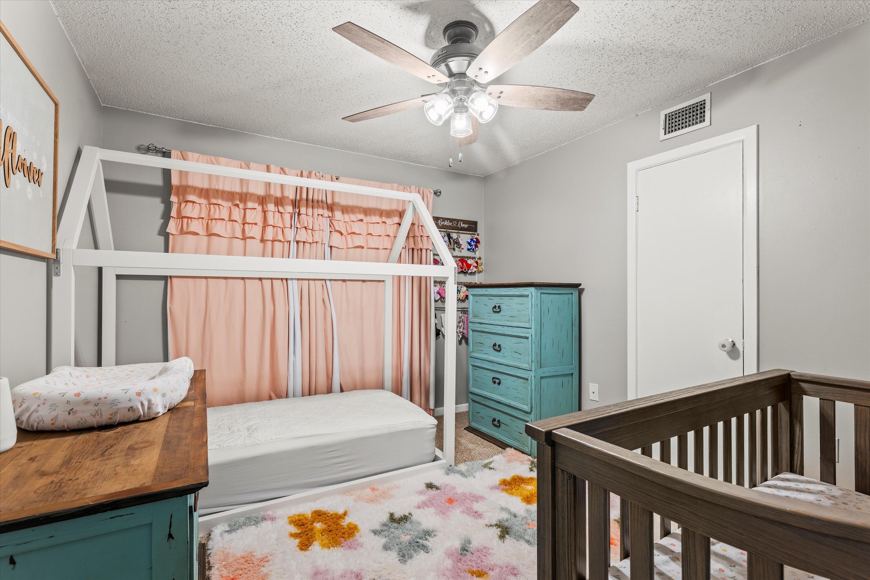 804 2nd Street Plains, TX 79355 - Photo 10 of 18 a bedroom with furniture and a window