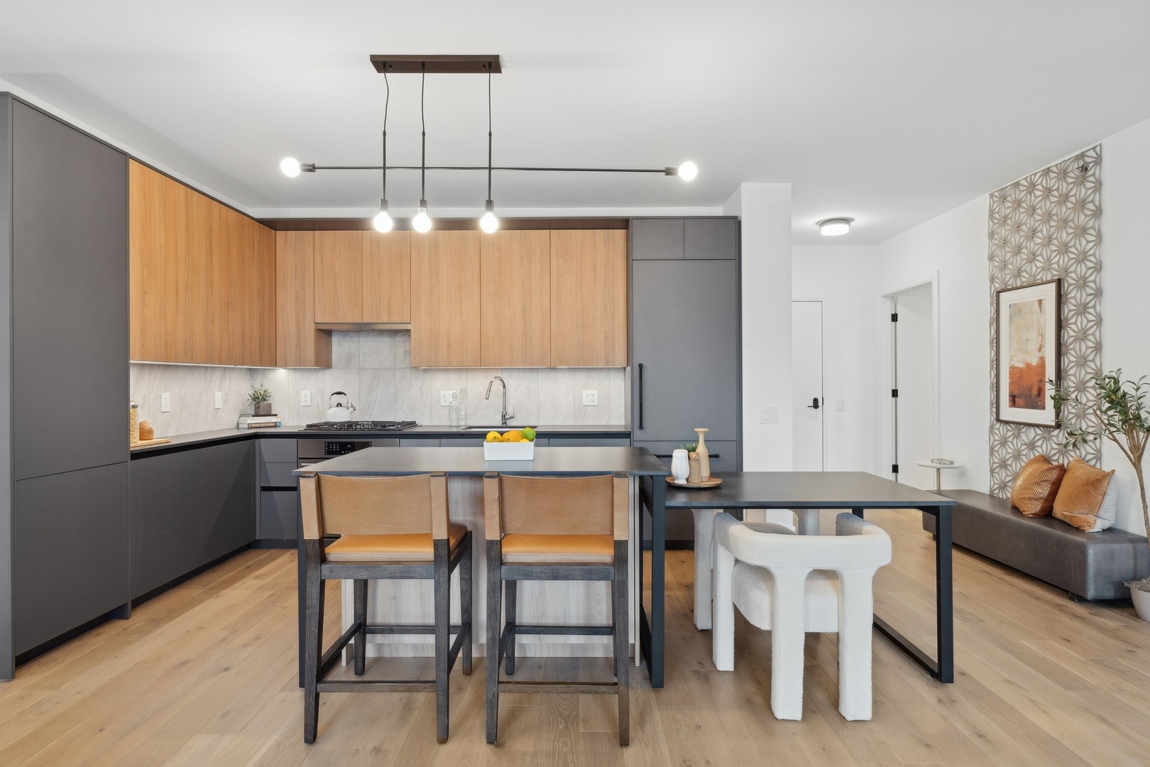 234 West Polk Street, Unit 3204 Chicago, IL 60607 - Photo 11 of 39 a kitchen with a table chairs refrigerator and cabinets
