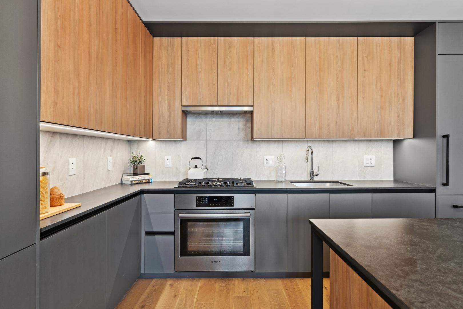 234 West Polk Street, Unit 3204 Chicago, IL 60607 - Photo 13 of 39 a kitchen with a sink a stove and cabinets