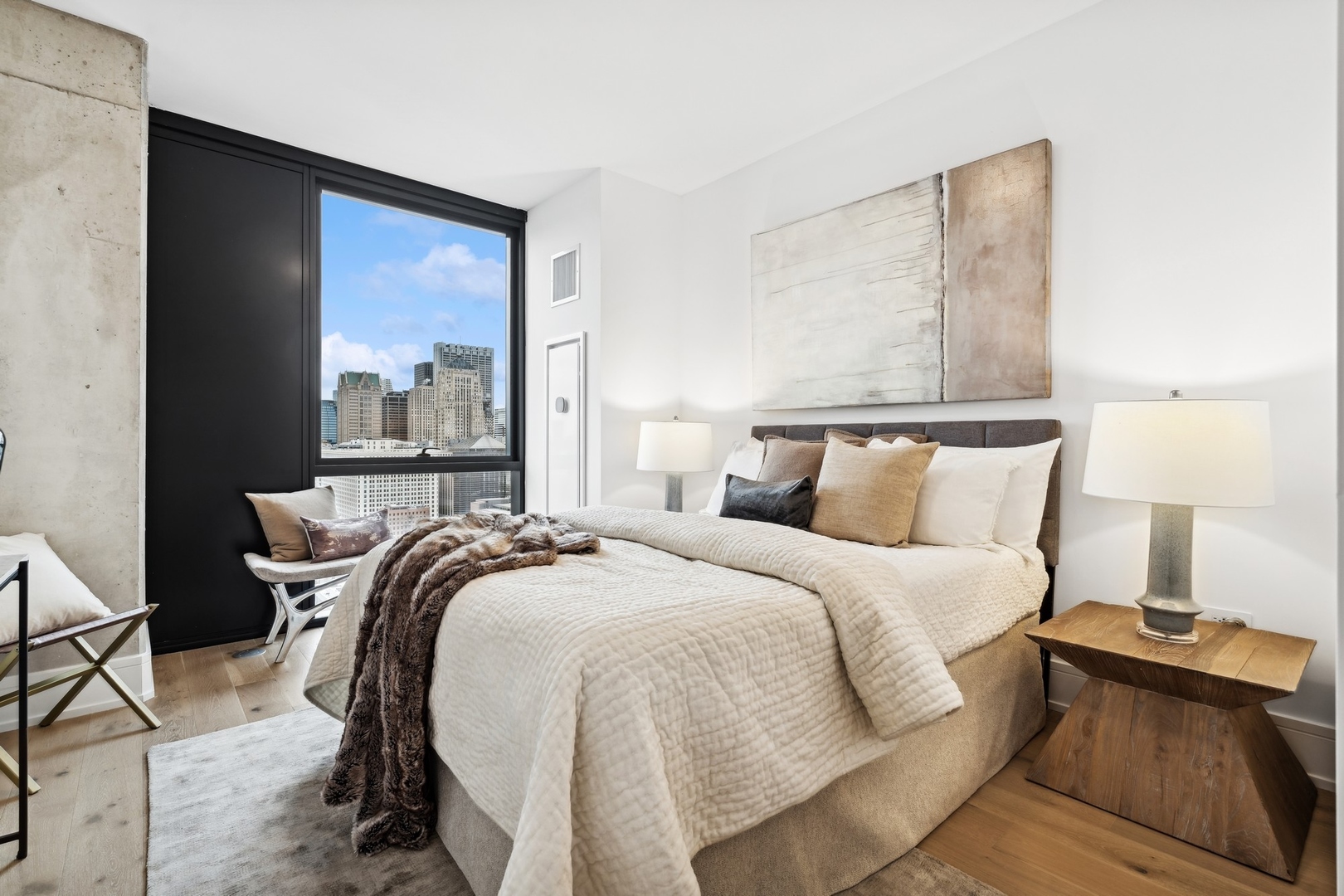 234 West Polk Street, Unit 3204 Chicago, IL 60607 - Photo 15 of 39 a bed sitting in a bedroom next to a window
