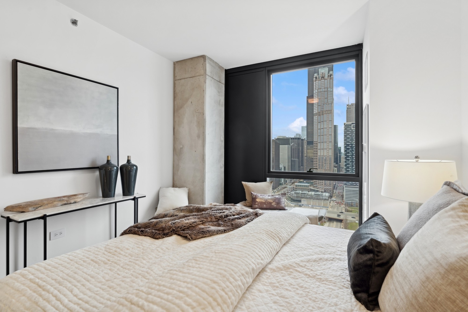234 West Polk Street, Unit 3204 Chicago, IL 60607 - Photo 16 of 39 a bedroom with a bed and glass door