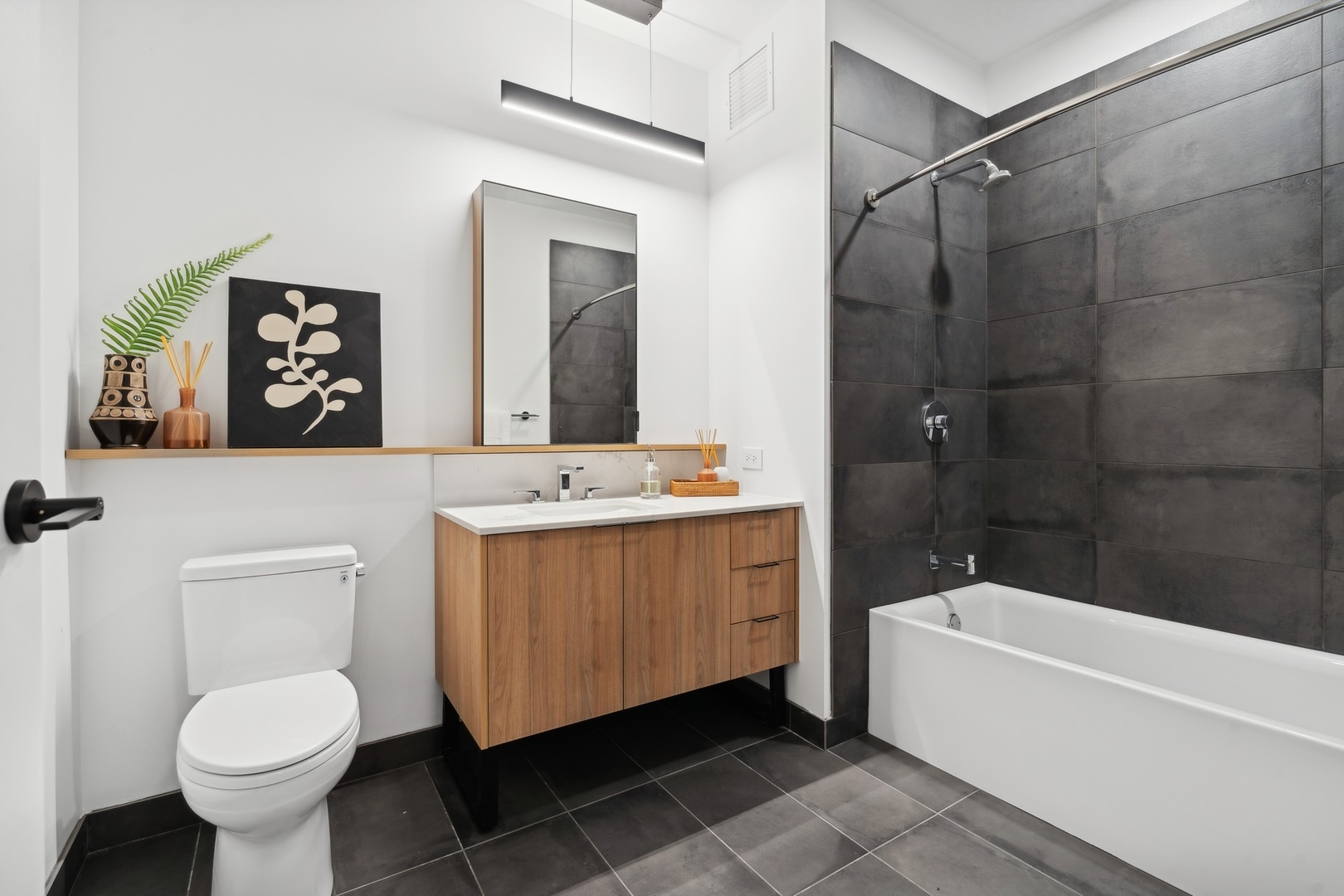 234 West Polk Street, Unit 3204 Chicago, IL 60607 - Photo 19 of 39 a bathroom with a sink toilet and shower