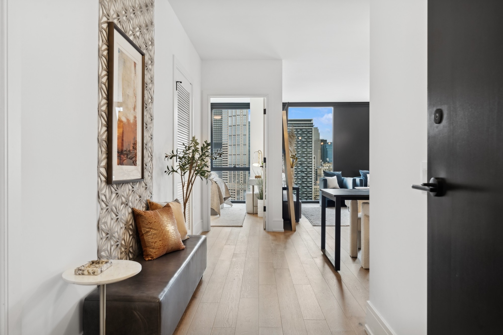 234 West Polk Street, Unit 3204 Chicago, IL 60607 - Photo 3 of 39 a living room with furniture and wooden floor