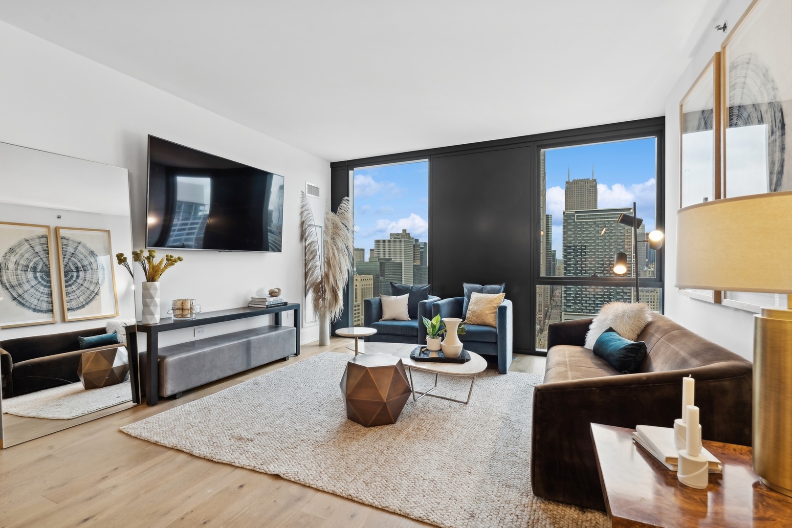 234 West Polk Street, Unit 3204 Chicago, IL 60607 - Photo 6 of 39 a living room with furniture and a flat screen tv