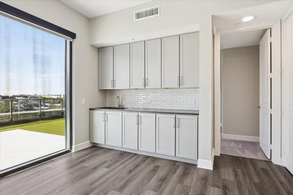 a view of cabinets with wooden floor
