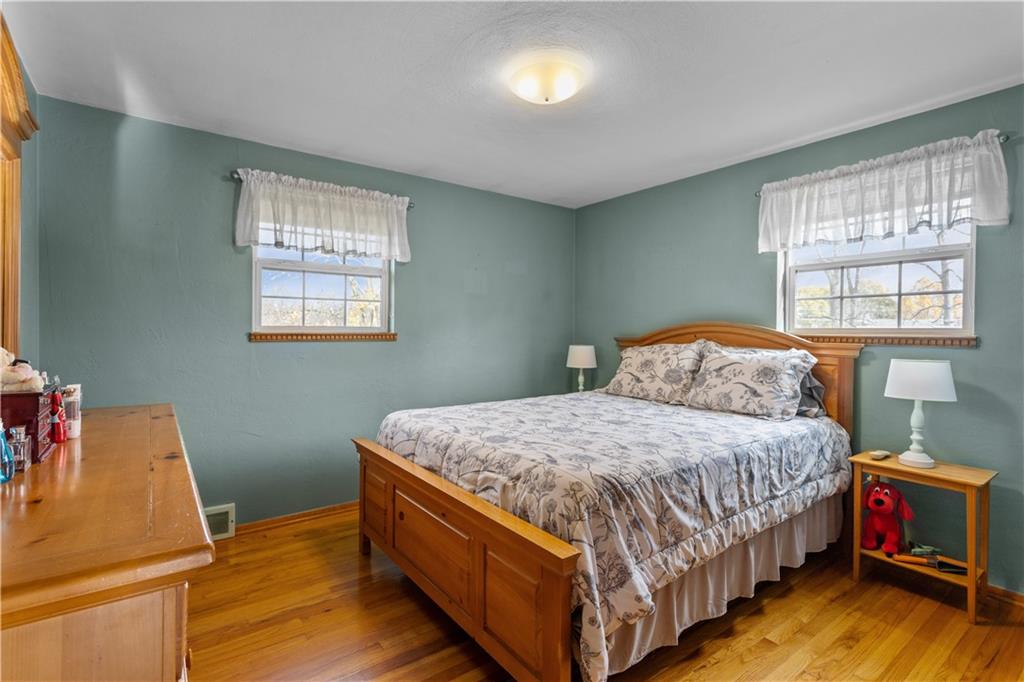 90 Davis Road Coraopolis, PA 15108 - Photo 13 of 29 a bed sitting in a bedroom next to a window