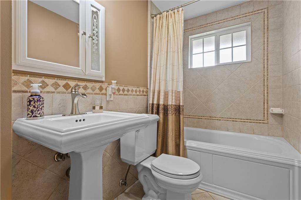 90 Davis Road Coraopolis, PA 15108 - Photo 17 of 29 a bathroom with a sink toilet and shower