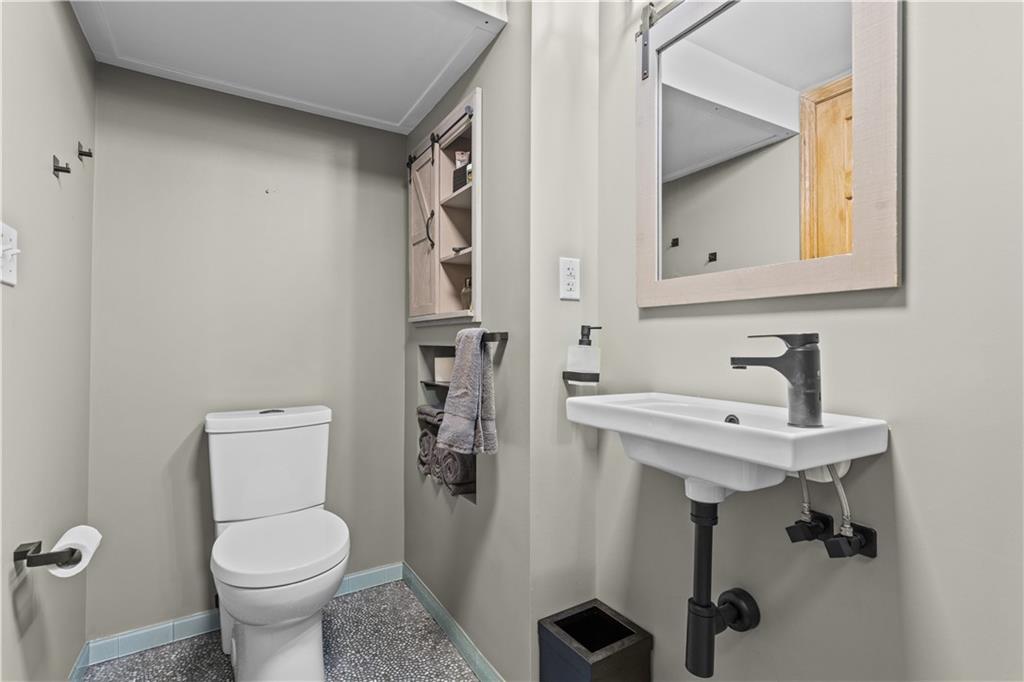 90 Davis Road Coraopolis, PA 15108 - Photo 21 of 29 a bathroom with a toilet sink and mirror