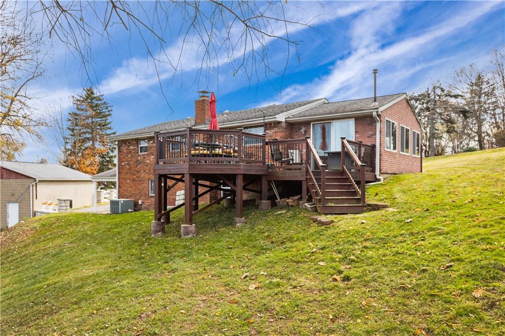 90 Davis Road Coraopolis, PA 15108 - Photo 24 of 29 a view of a house with a big yard and large trees