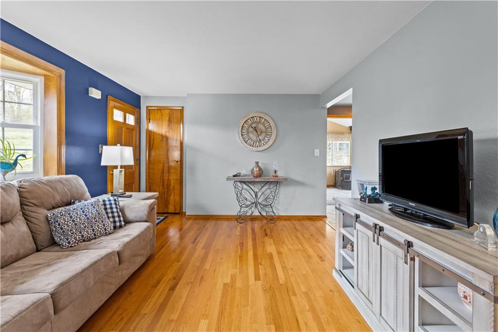 90 Davis Road Coraopolis, PA 15108 - Photo 4 of 29 a spacious bedroom with a bed and a flat screen television