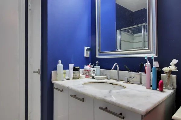 a bathroom with a sink and a mirror