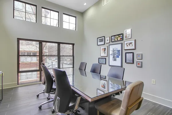 a view of a work space with furniture and wooden floor