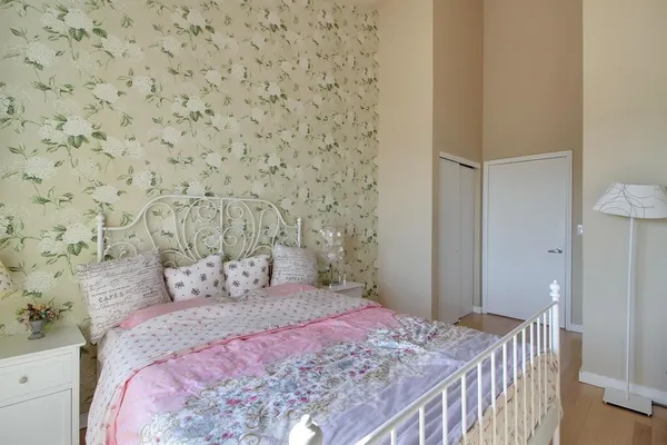 a bedroom with a bed and a cabinets