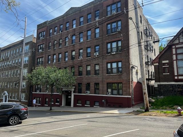 331 79th Street, Unit 15 North Bergen, NJ 07047 - Photo 1 of 13 a view of a building and a cars on street