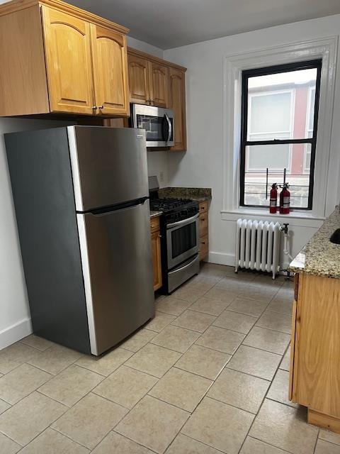 331 79th Street, Unit 15 North Bergen, NJ 07047 - Photo 9 of 13 a kitchen with a refrigerator and window