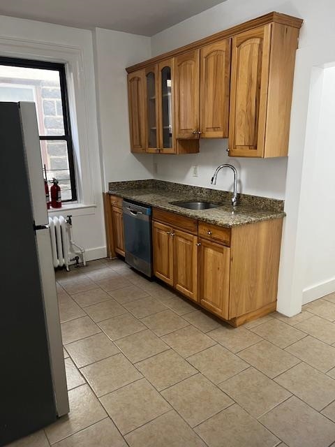 331 79th Street, Unit 15 North Bergen, NJ 07047 - Photo 10 of 13 a kitchen with stainless steel appliances granite countertop a sink stove and cabinets