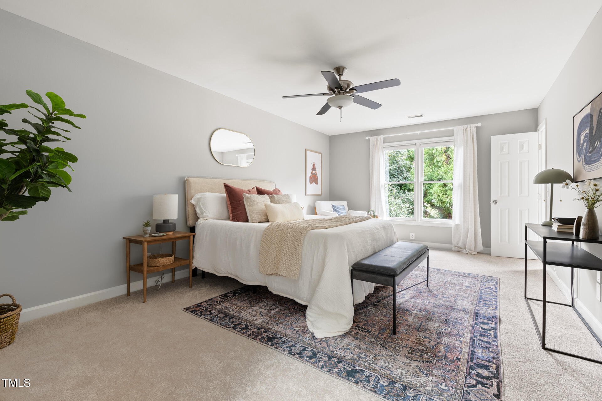 2408 Scouting Trail Raleigh, NC 27615 - Photo 23 of 45 a bed room with a bed and a chandelier
