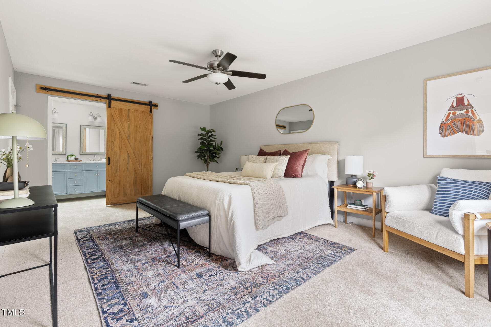 2408 Scouting Trail Raleigh, NC 27615 - Photo 25 of 45 a bedroom with a bed a rug and potted plant