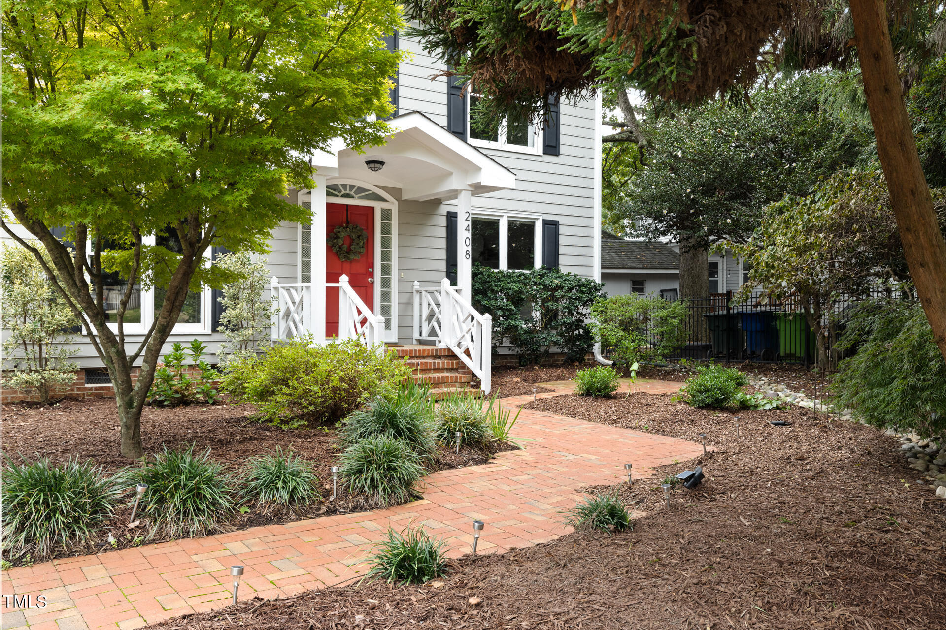 2408 Scouting Trail Raleigh, NC 27615 - Photo 4 of 45 a front view of a house with garden